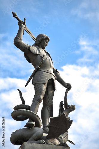 Obraz na plátně old statue depicting man killing dragon