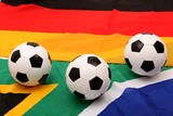 soccer balls on south africa and german flag