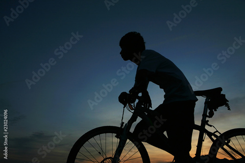 young asian man with bike