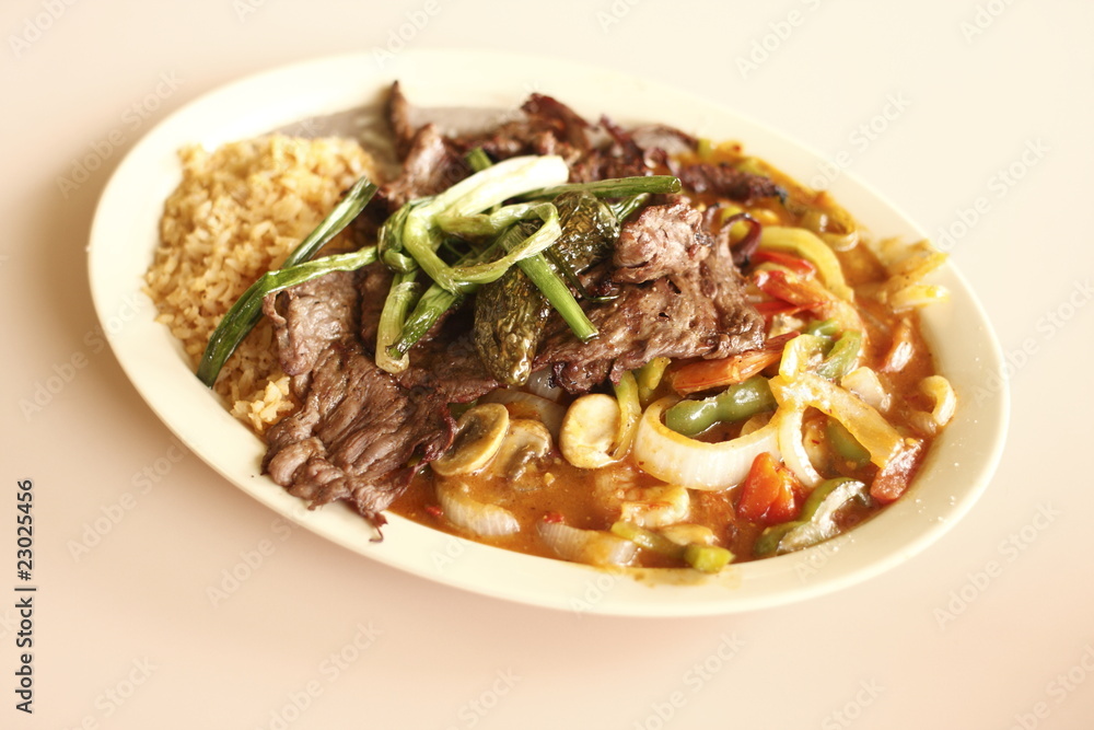 A tasty Mexican dish with beef and shrimp A tasty Mexican dish with beef and shrimp