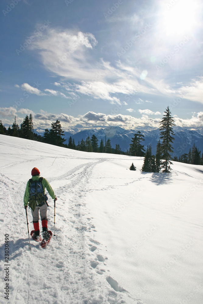 Women in the winter snow shoe hiking.