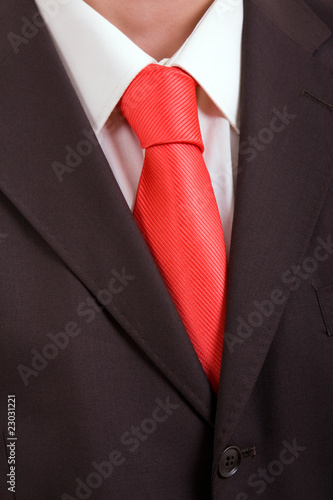 Detail of a Business man Suit with orange tie