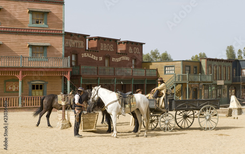 Cowboys watering horses
