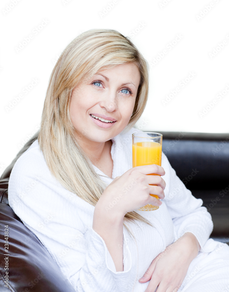 Radiant woman drinking an orange jus Radiant woman drinking an orange jus