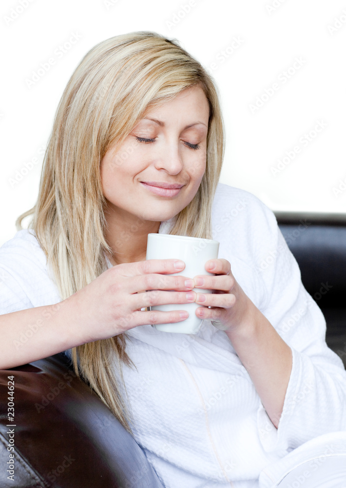 Cute woman holding a cup of coffee Cute woman holding a cup of coffee