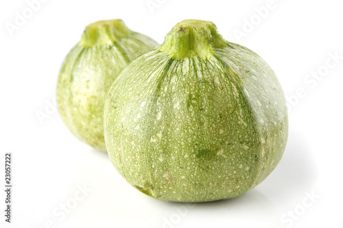 green courgettes on white