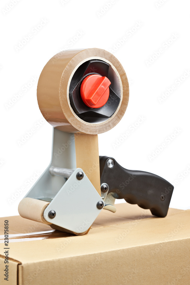 Fototapeta premium Packaging tape dispenser and shipping box
