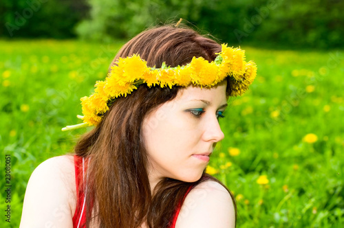 portrait of young woman in dandelion garland