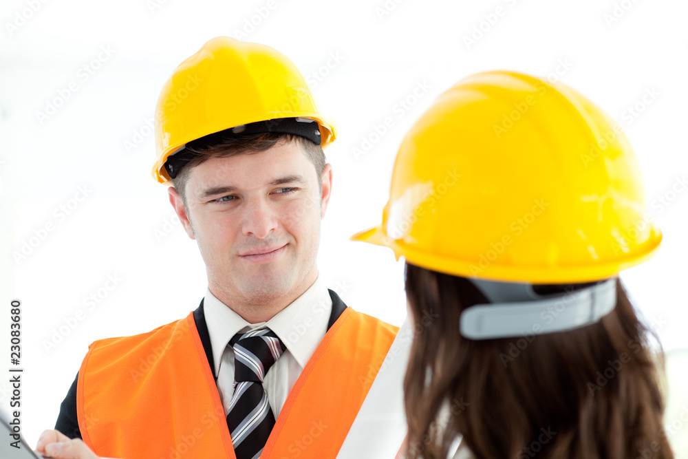 Confident architect discussing with his colleague