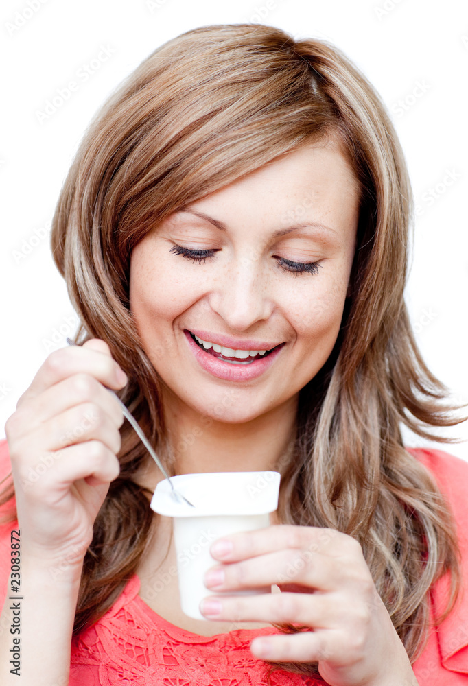 Radiant woman eating a yogurt Radiant woman eating a yogurt