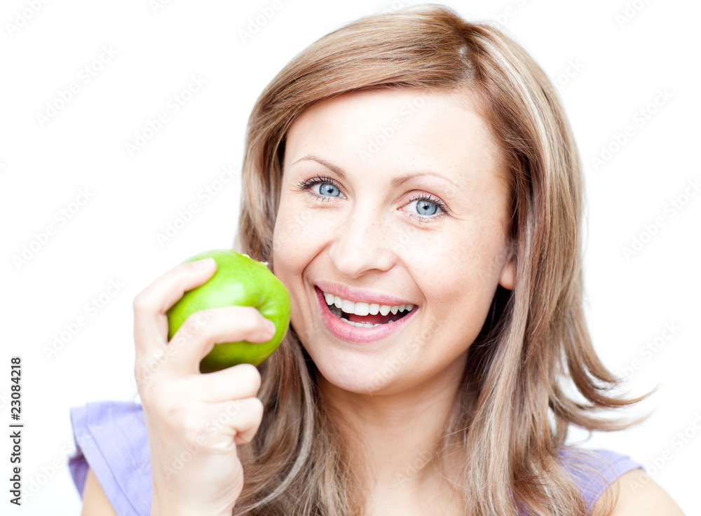 Delighted woman holding an apple Delighted woman holding an apple