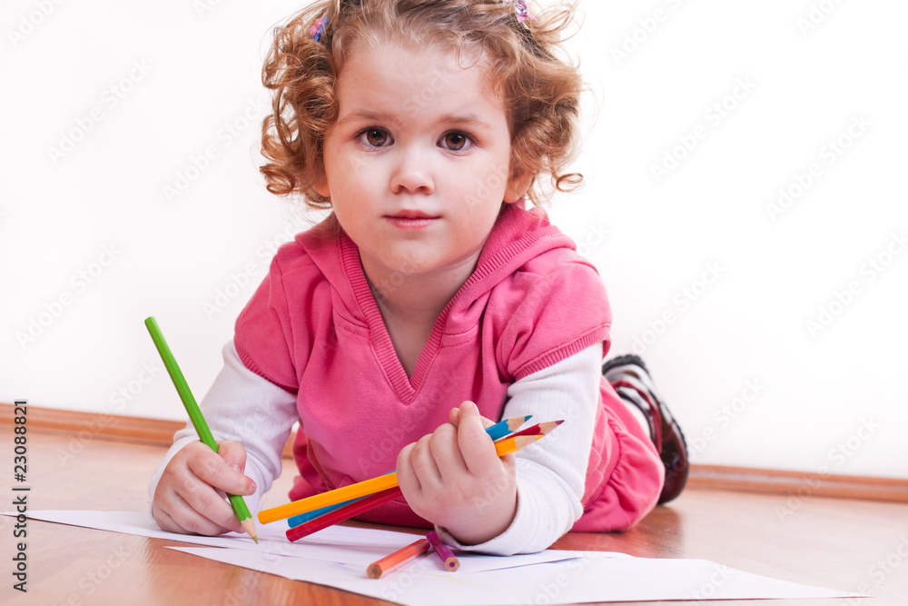 cute girl is drawing