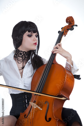 Attractive girl playing cello