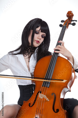 Romantic girl playing cello