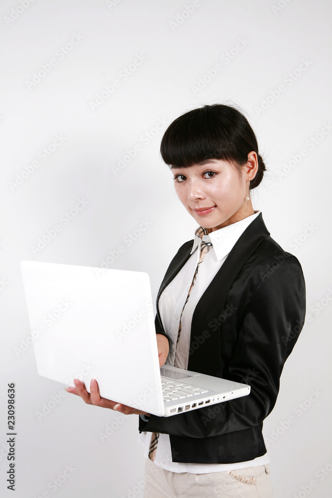 Businesswoman and portable computers on white Businesswoman and portable computers on white
