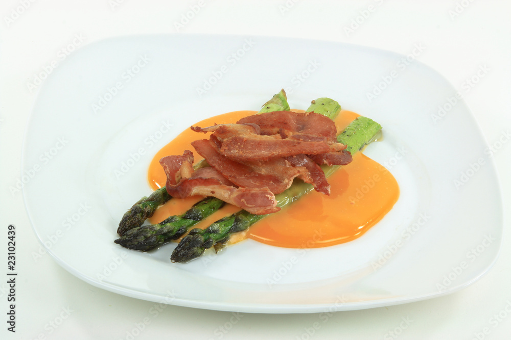Dish of Fried Bacon, Chees and Backed asparagus.