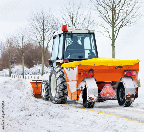 Tractor removes snow in a park