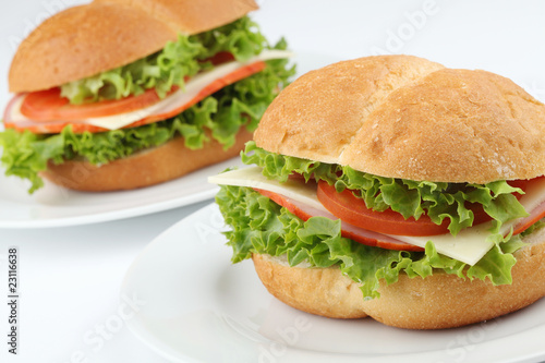 Ham and cheese sandwiches with tomatoes and lettuce