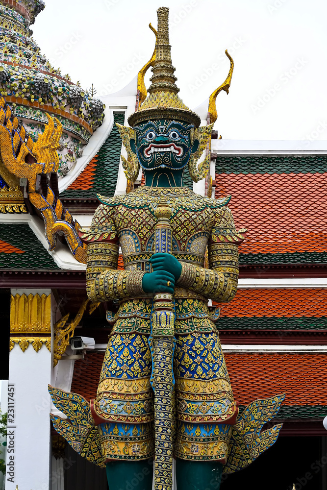 Fototapeta premium Green ogre statue with door