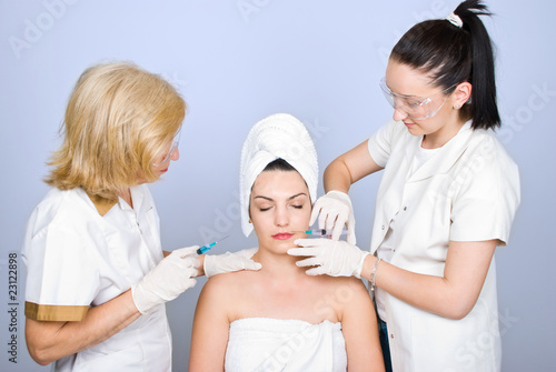 Plastic doctors giving botox shot