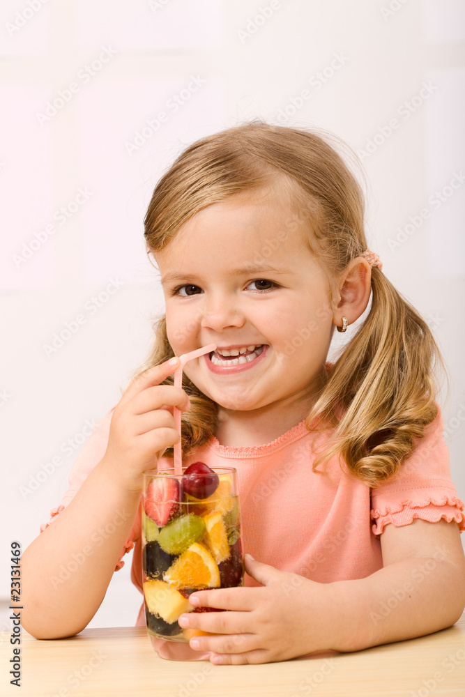 Happy little girl with fruit salad Happy little girl with fruit salad
