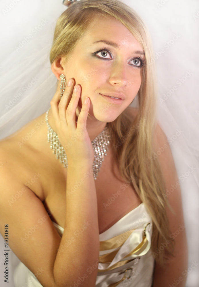 beautiful young blond girl in a wedding dress