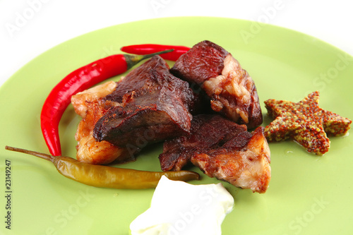 roast meat chunks on green plate