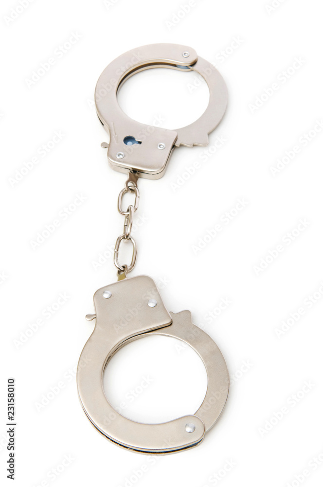 Metal handcuffs isolated on the white background Metal handcuffs isolated on the white background