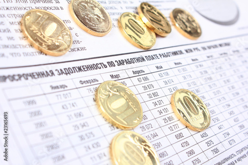Ten rouble coins on the newspaper