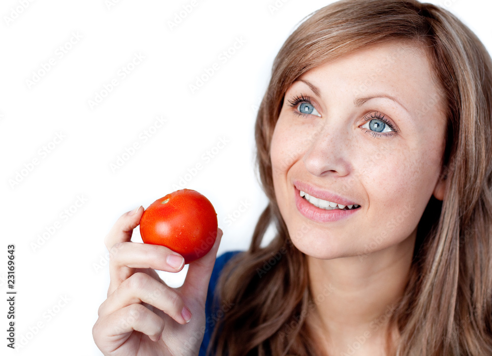 Positive woman holding a tomato Positive woman holding a tomato