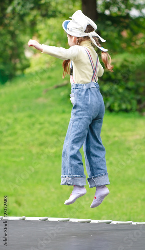 Girl jumping on the trampoline