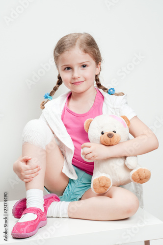 Little girl with bandage on knee