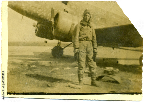 man near old airplane