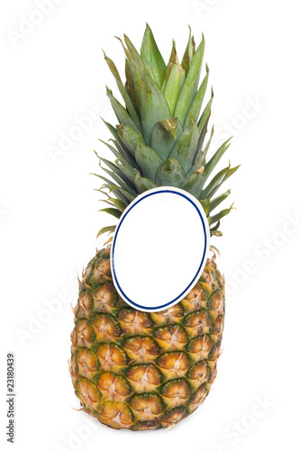 Ripe pineapple with a paper price tag.