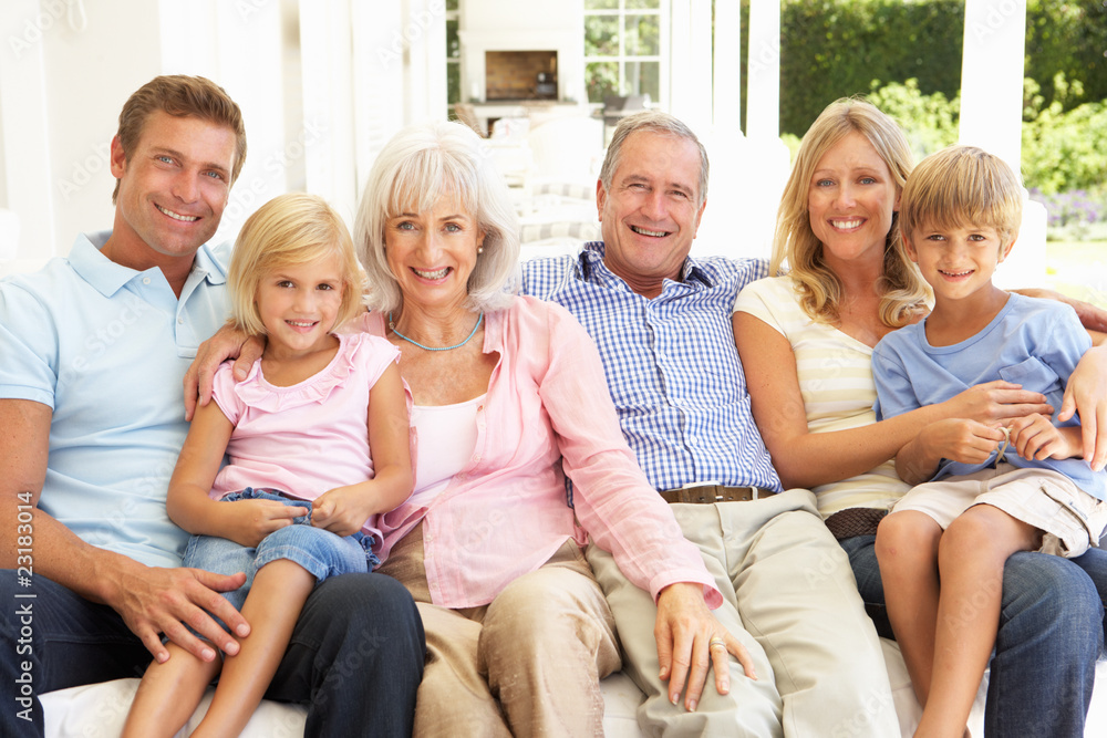 Extended Family Relaxing Together On Sofa Extended Family Relaxing Together On Sofa