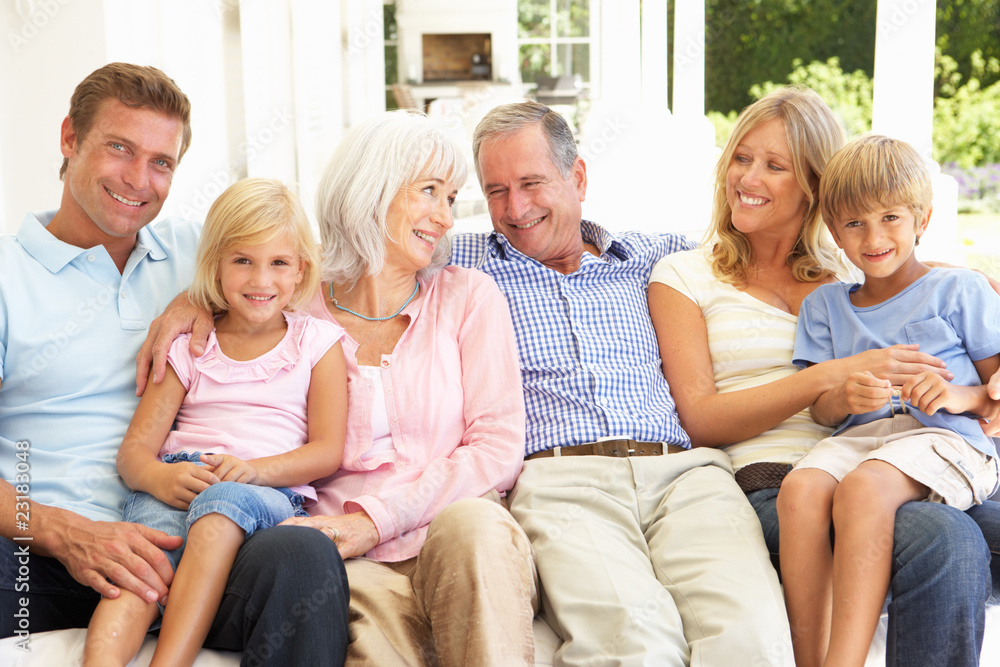 Extended Family Relaxing Together On Sofa Extended Family Relaxing Together On Sofa