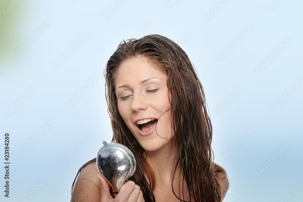 Fototapeta premium Young woman singing under shower