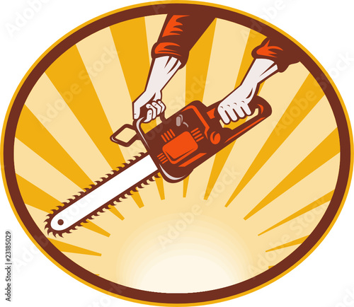 hand holding chainsaw with sunburst in background