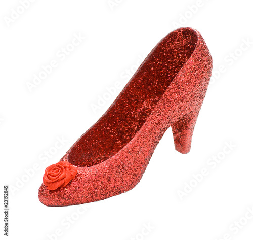 There’s no place like home – A ruby red stiletto shoe, isolated