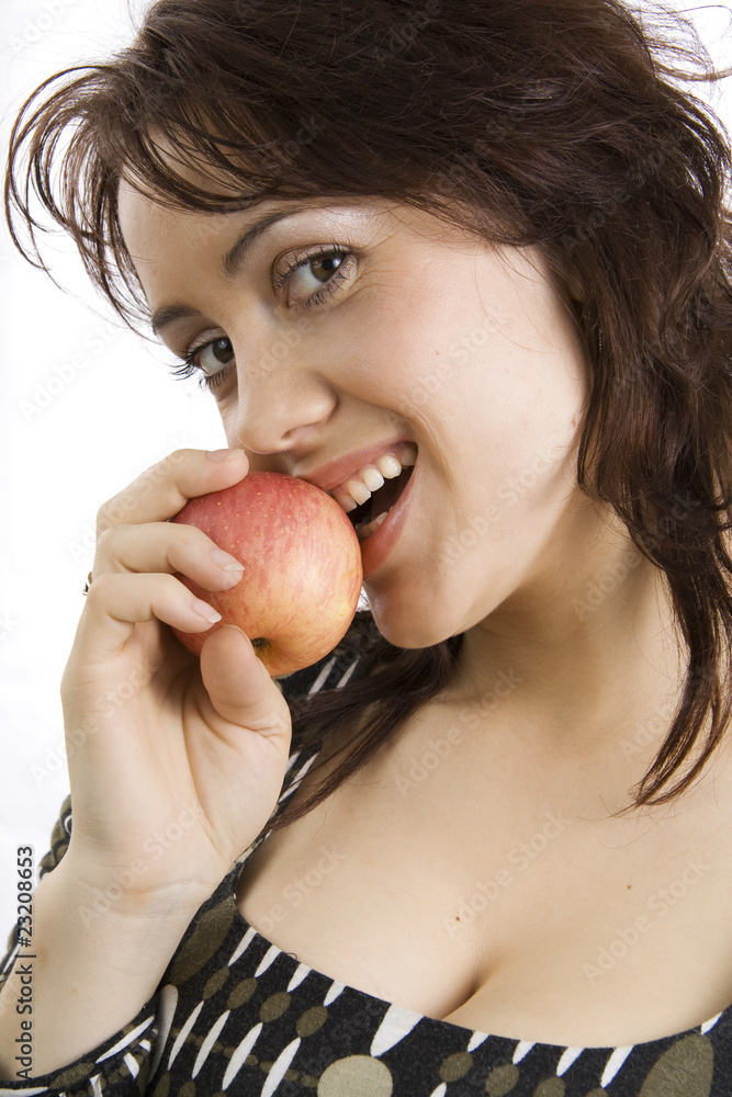 The beautiful young woman eats an apple The beautiful young woman eats an apple