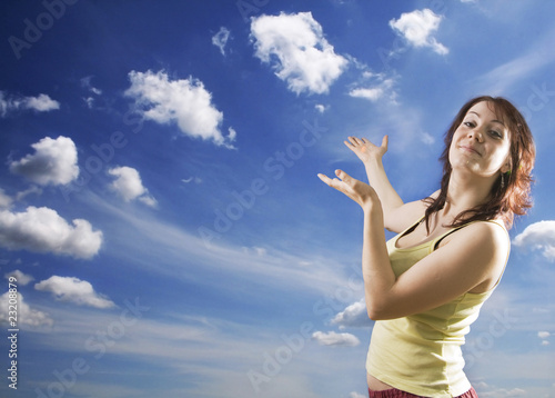 Adoration of heaven. Woman against the sky and clouds.