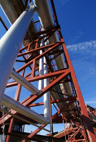 Industrial zone, Steel pipelines and support structures on blue