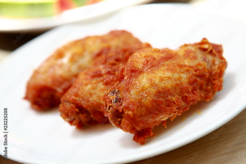 Plate of crispy, delicious fried chicken .