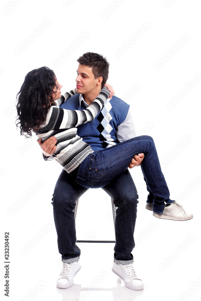 portrait of a young couple sitting on a chair portrait of a young couple sitting on a chair
