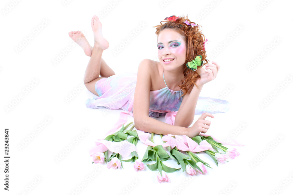Red-haired woman with flowers and butterflies on her head lying Red-haired woman with flowers and butterflies on her head lying