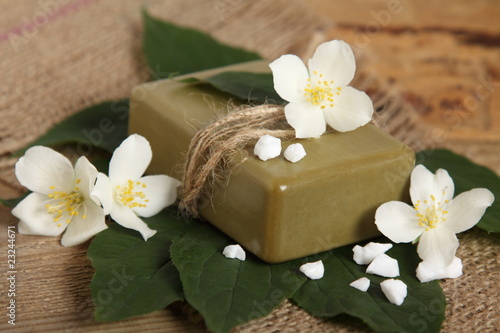 Bar of natural handmade soap on leaves. Spa