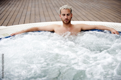 Принти на полотні Handsome man in jacuzzi