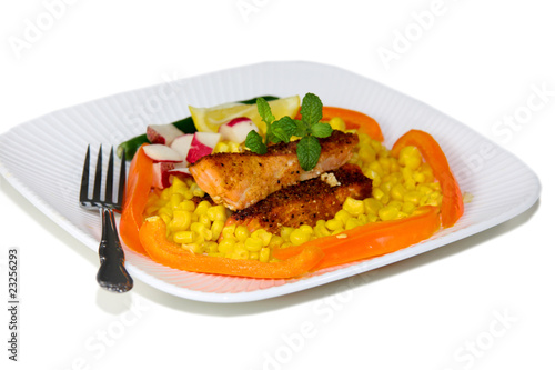 Baked spicy Salmon fish fillets on corn