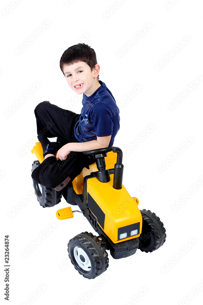 small boy on the yellow tractor
