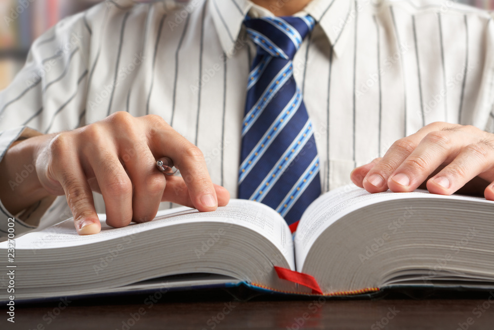 Businessman or professor reading journal Businessman or professor reading journal